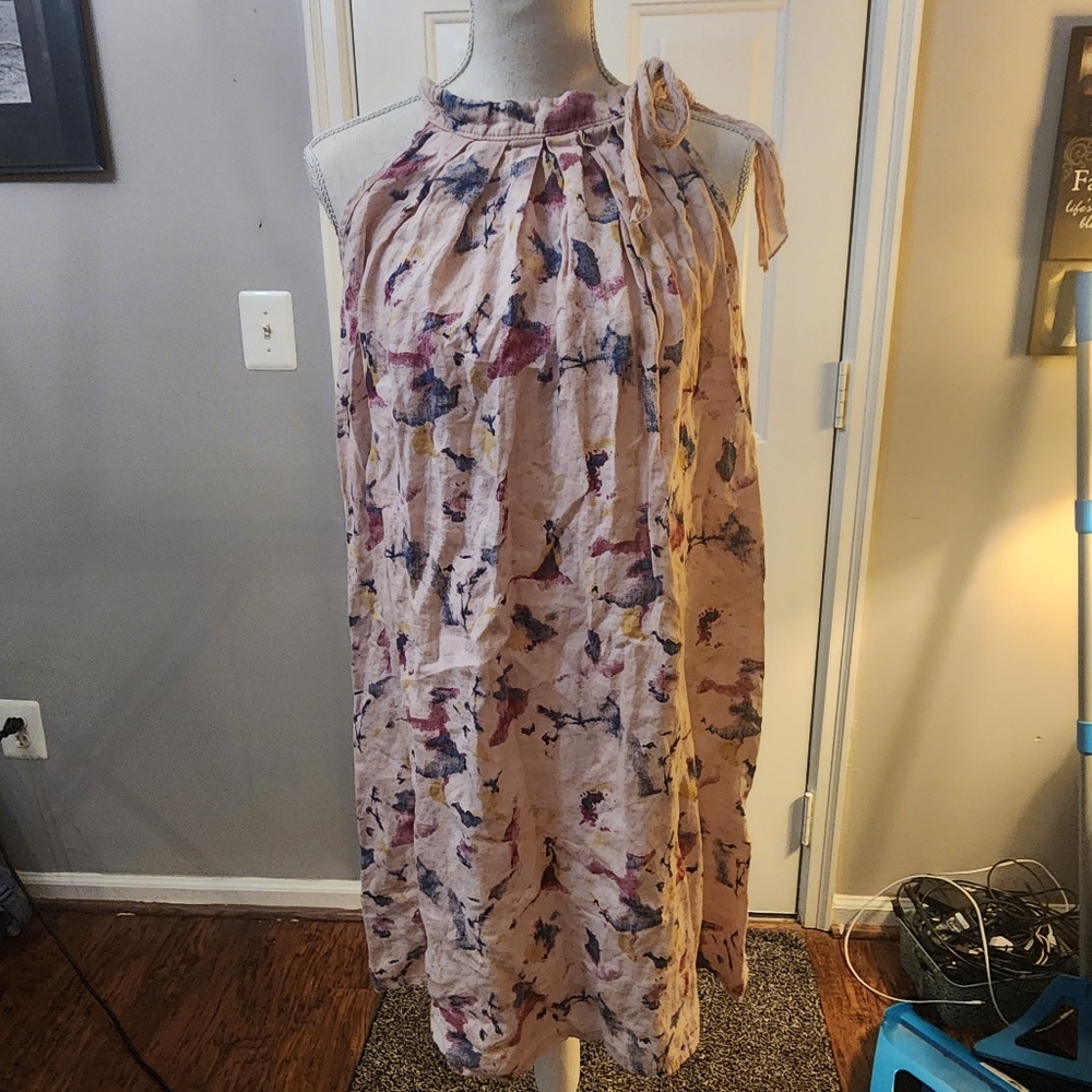 Pink linen dress with abstract prints, ties on size at neck.